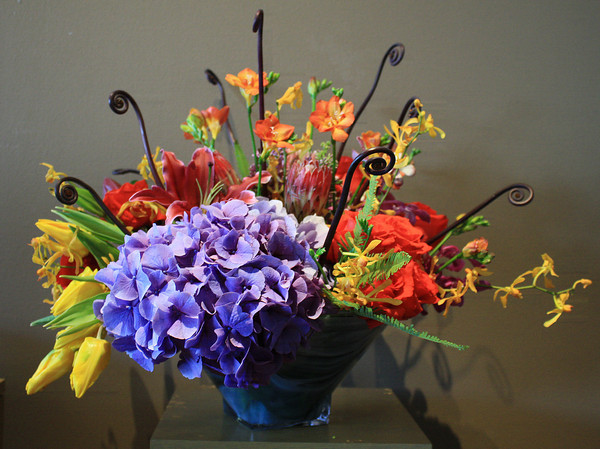 A vase filled with flowers on top of a table.