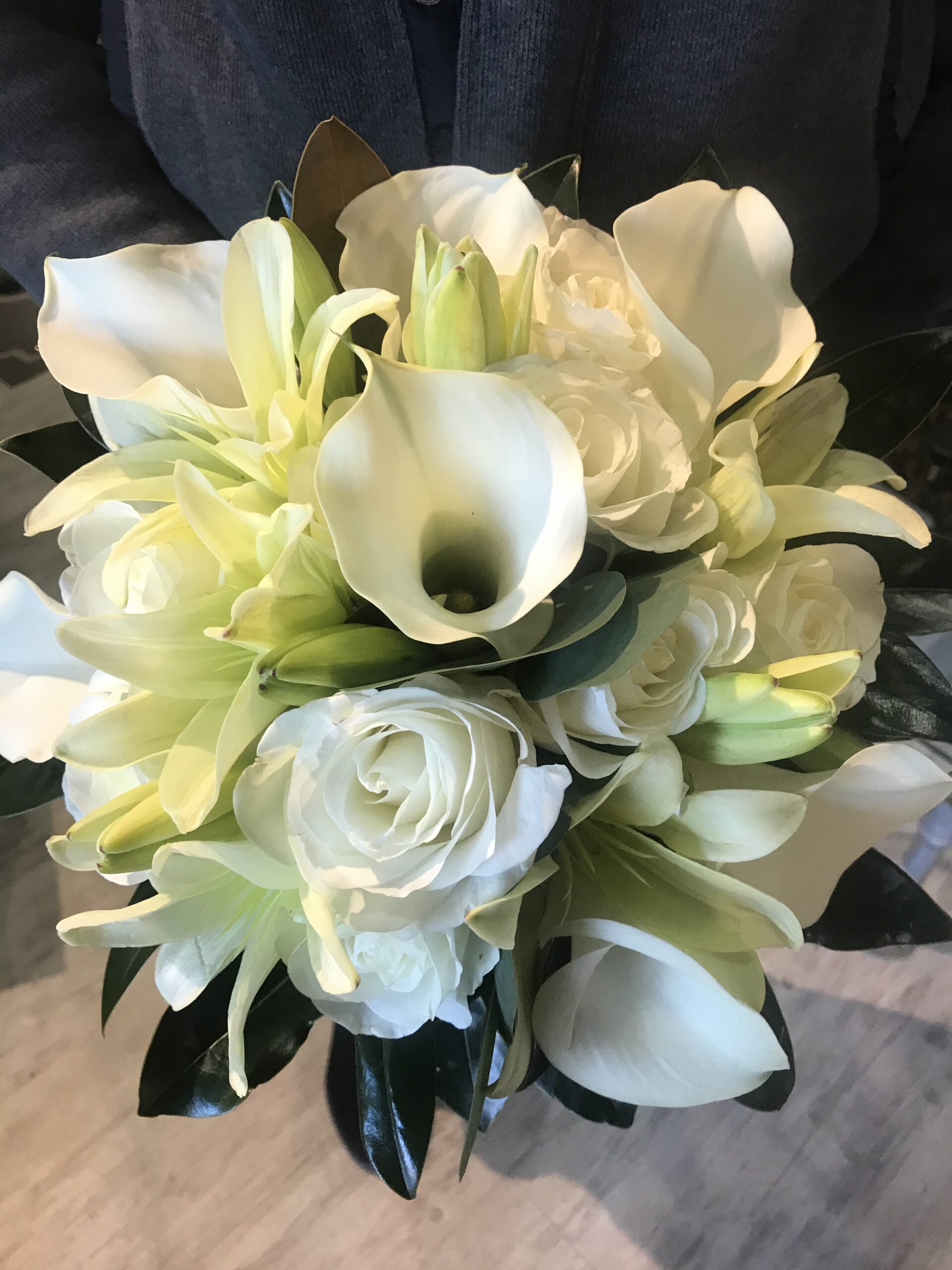A bouquet of white flowers in a vase.